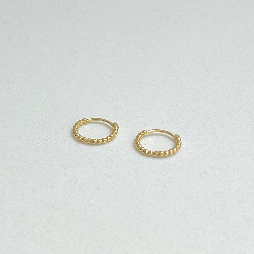 small gold beaded huggie earrings by Misia Mae
