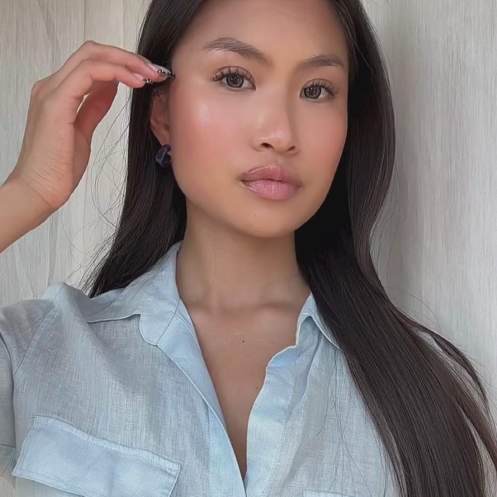 brunette young women wearing blue tortoiseshell earrings by Misia Mae