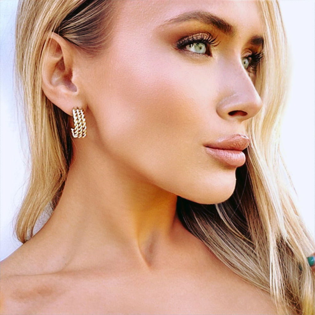 A blonde woman wearing rope earrings by Misia Mae