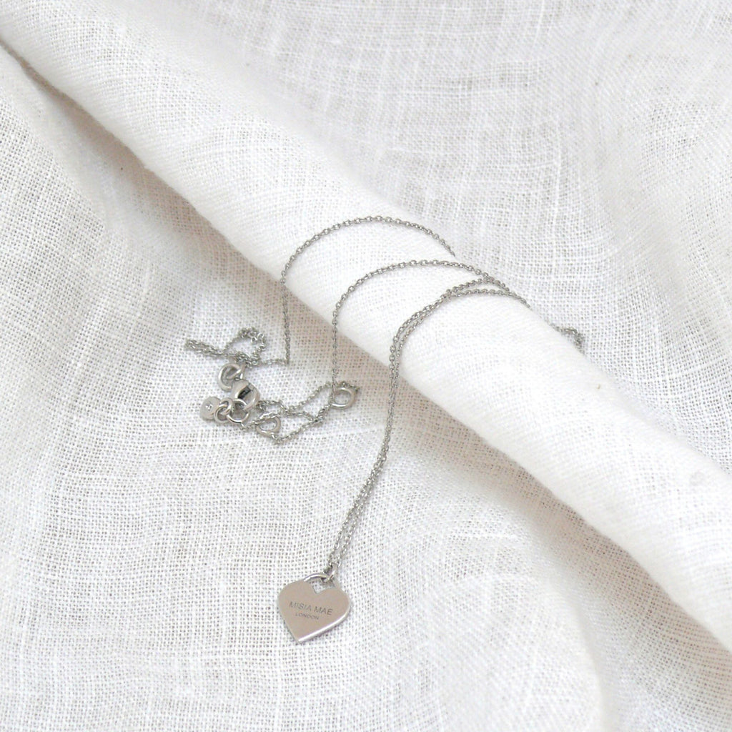 Daisy Silver Necklace - Misia Mae London on a white linen background